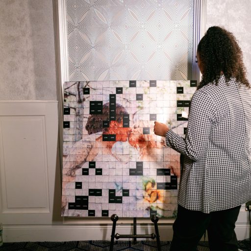 A lady using the Mosaic wall